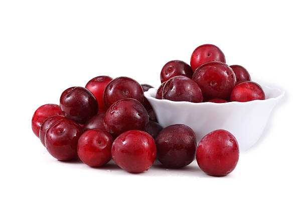istock Red plums, dish and leaves 639582972