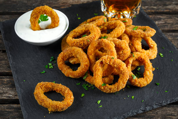istock Fried Breaded Onion Rings with sauce and beer 639583834