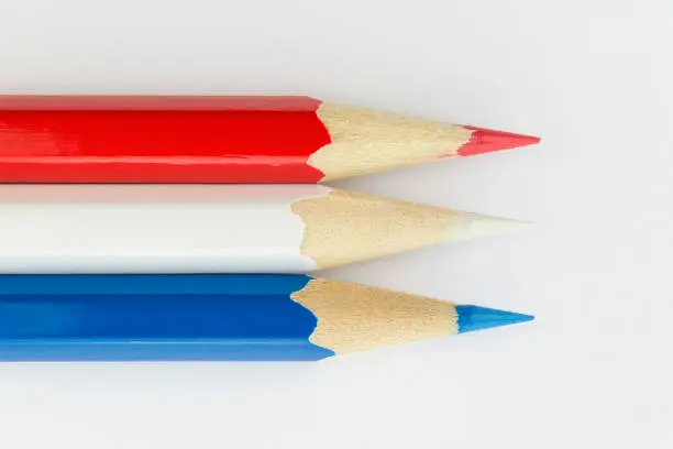 Collection of colorfull pencils in the colors of the Dutch flag as a background picture.