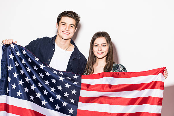 istock Young couple with US flag in hands 639588080