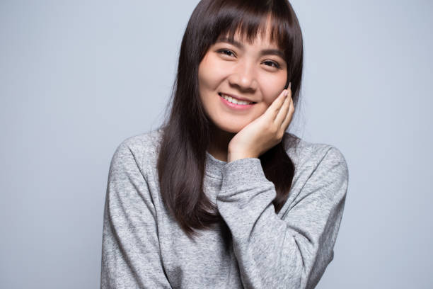 istock Shy woman on isolated background 639588762