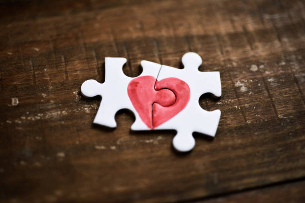 istock pieces of a puzzle forming a heart 639589054