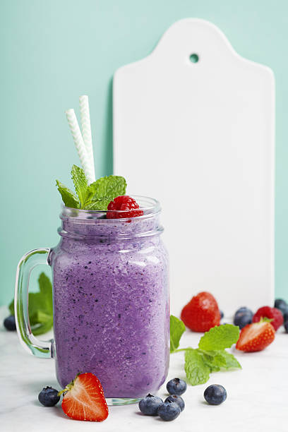 istock Blueberry smoothie and White ceramic serving board 639589160