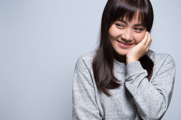 istock Shy woman on isolated background 639589180