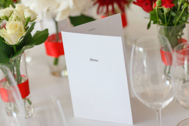 istock table laying flower arrangement menu 639589246