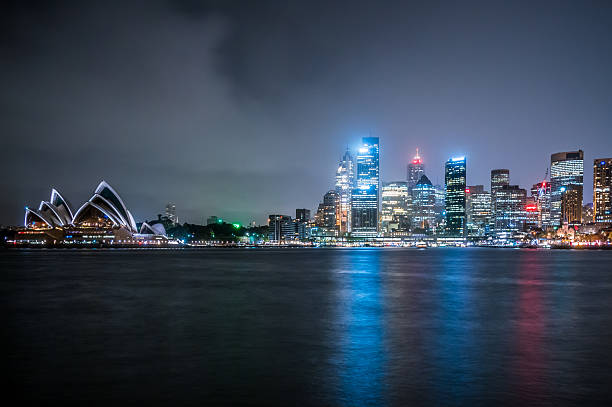 View of skyscrapers and landmarks in Sydney at night.