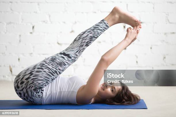Fitness Woman Doing Exercises On Sport Mat Stock Photo - Download Image Now - Yoga, Hip - Body Part, Picking Up