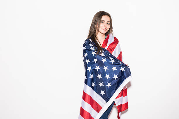 istock Young girl covered US flag on white 639594344