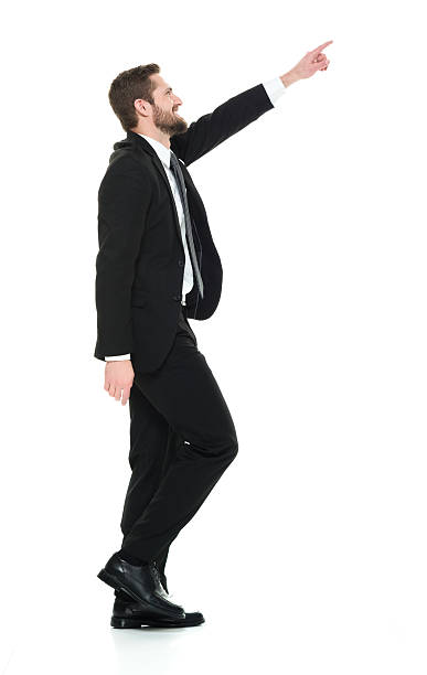 istock Businessman pointing and walking 639594618