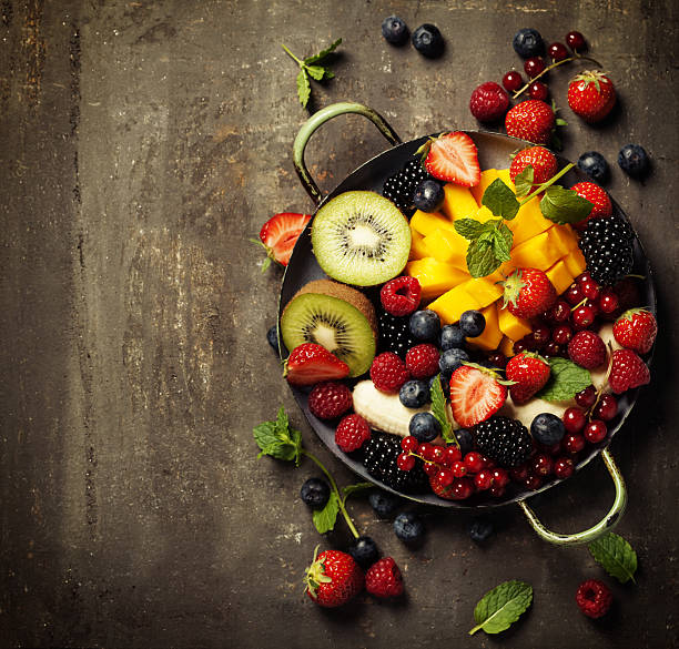 istock fresh fruits and berries on plate 639595476