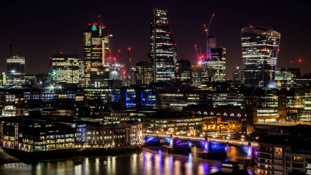 istock City towers at night with reflections in the river 639596452