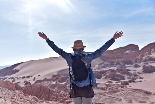 Moon Valley in Atacama,Chile Traveling woman in hat. Moon Valley. Atacama Desert. Chile chile tourist stock pictures, royalty-free photos & images