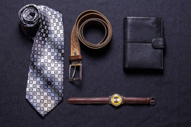 istock Men's accessories on black background tie wallet watch strap sho 639599930