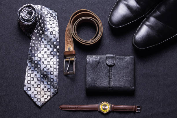 istock Men's accessories on black background tie wallet watch strap sho 639599982