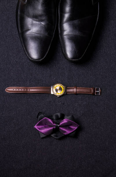 istock Men's accessories on black background tie wallet watch strap sho 639601208