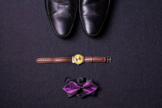 istock Men's accessories on black background tie wallet watch strap sho 639601238