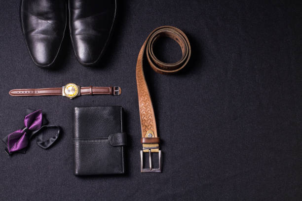 istock Men's accessories on black background tie wallet watch strap sho 639601314