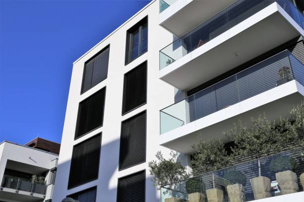 istock Windows with blinds on a apartment building 639602598