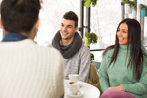 istock Friends talking and drinking coffee in cafe 639604042