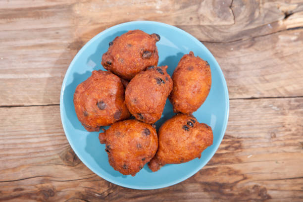 istock Traditional Dutch oliebollen on wooden background 639604182