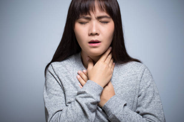 istock Woman has sore throat 639604256