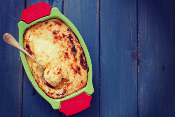 istock baked mashed potato with fish in green dish 639605120