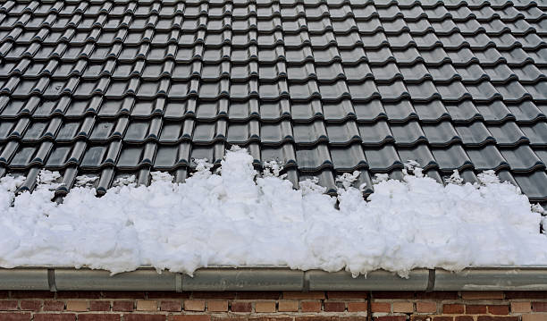 istock Snow filled gutter slided from the roof 639606532