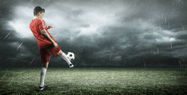 istock Football player is kicking a ball 639606534