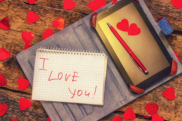istock Card with Message Love You. Handwritten text the tablet and 639606764