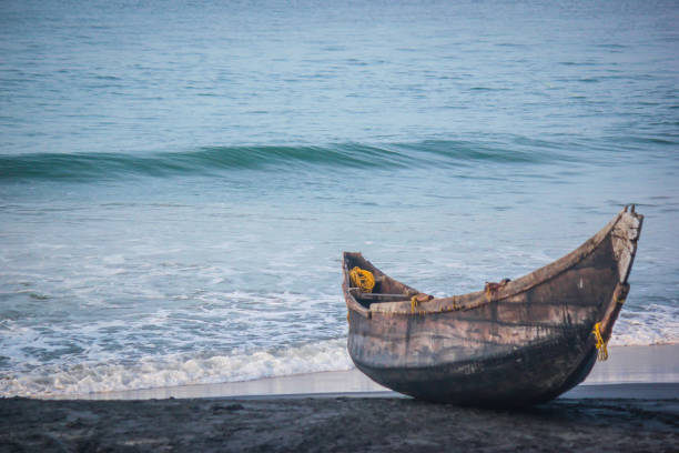 wooden traditional canoe on indian beach