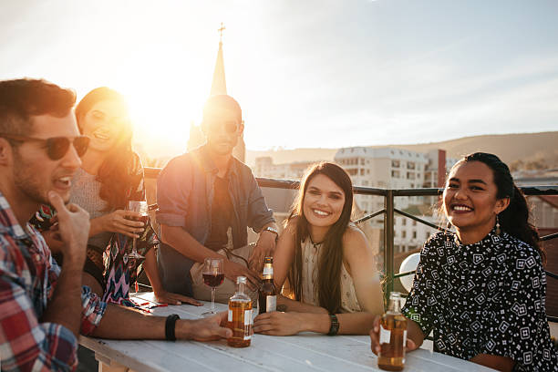 istock Group of happy young people having party 639607350