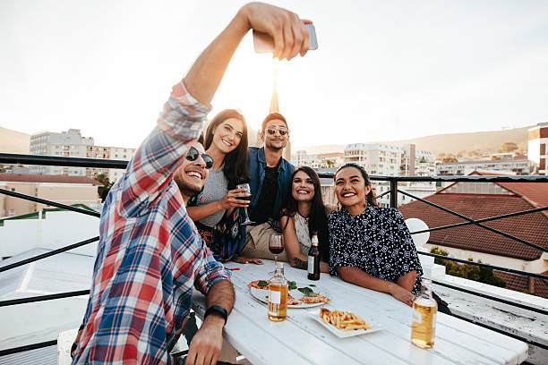 istock Group selfie at rooftop party 639607524