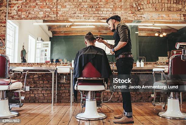 Hairstylist Serving Client At Barber Shop Stock Photo - Download Image Now - Barber Shop, Barber, Hair Salon