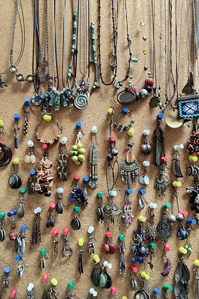 istock Earrings and necklaces collection hanging on a cork wall 639610580