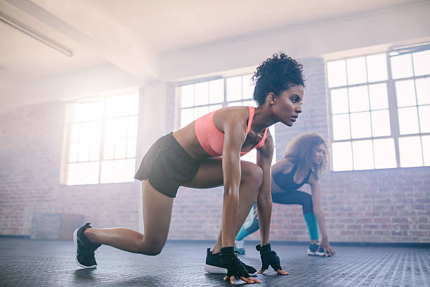 istock Young women doing workout together in gym. 639611020
