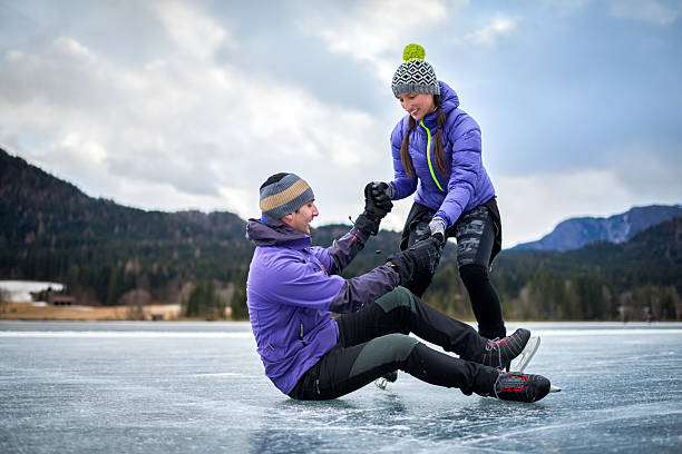 istock Couple on frozen lake 639611996