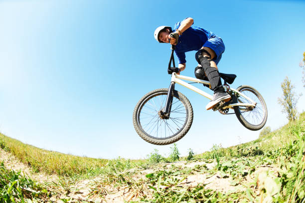 istock cyclist riding jumping with bicycle cross-country 639612706