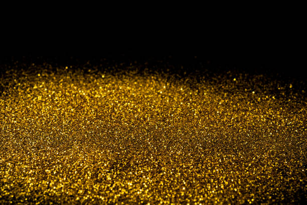 istock Sprinkle gold dust on a black background with copy space. 639612852