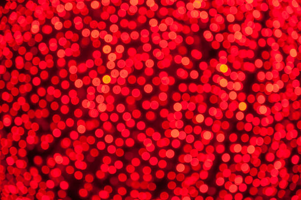 bokeh rouge noël illumunated lumières magiques fond - illumunated photos et images de collection