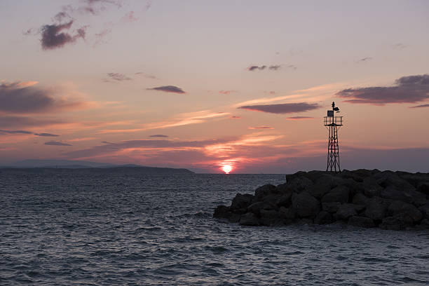 istock Mole or breakwater and the Aegean Sea at sunrise 639615982