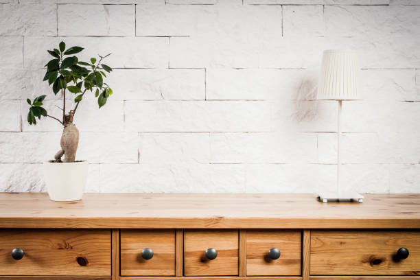 istock shelf with lamp and flower and white wall 639616472