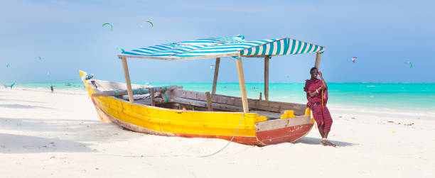 istock White tropical sandy beach on Zanzibar. 639619722