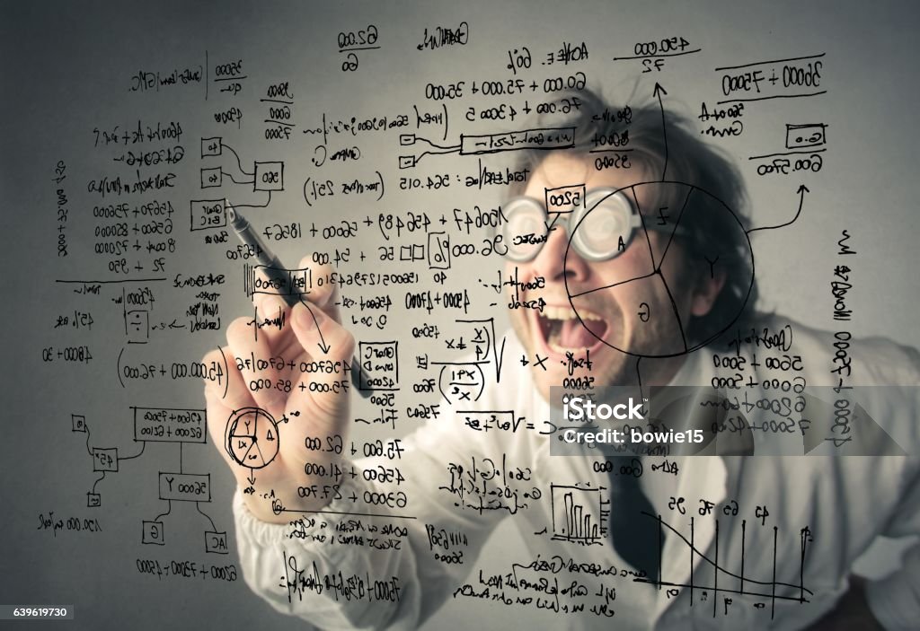 Crazy mathematician Mathematician is writing financial figures on a board Bizarre Stock Photo