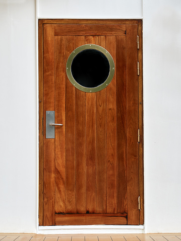 Wooden Door with porthole on ship