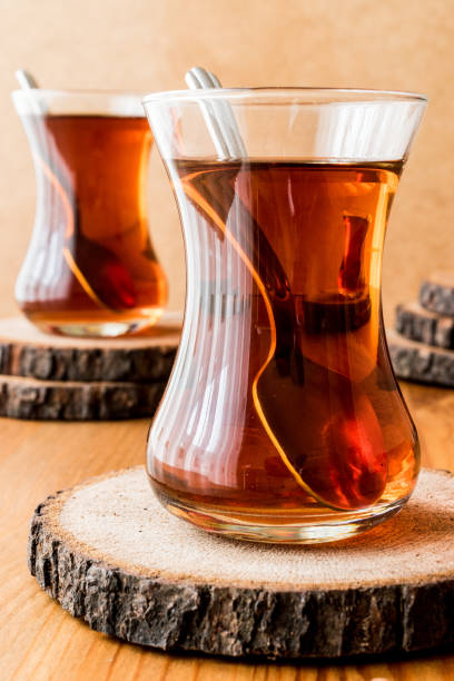 istock Traditional Turkish tea with spoon on wooden surface 639625346