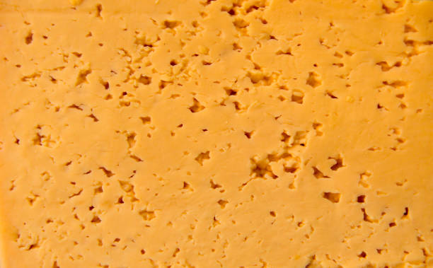 istock Texture of a fresh yellow cheese 639625978