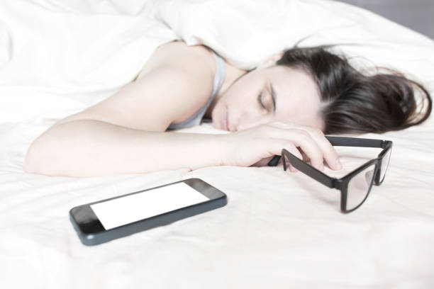 istock Tired young woman sleeping on bed 639626202