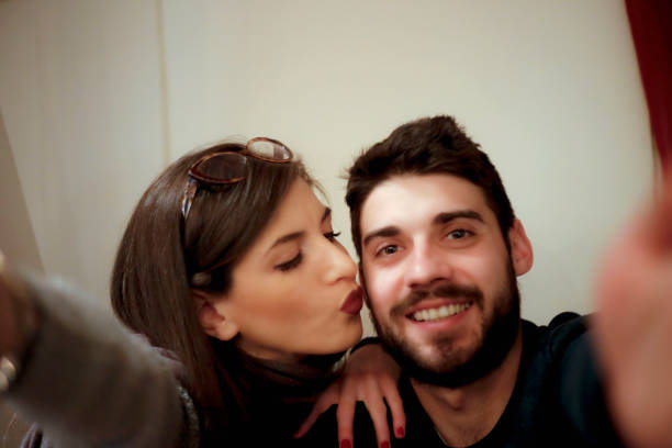 istock Happy young couple makes selfie 639626284