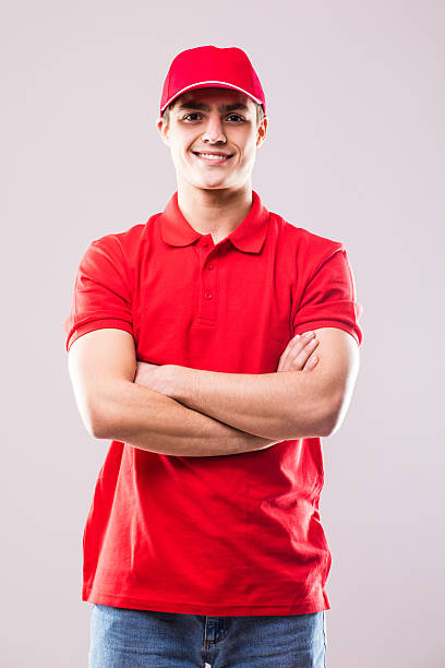 istock Deliveryman with crossed arms 639626306