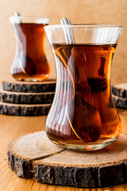 istock Traditional Turkish tea with spoon on wooden surface 639626540